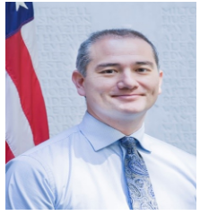 Author with American flag behind him